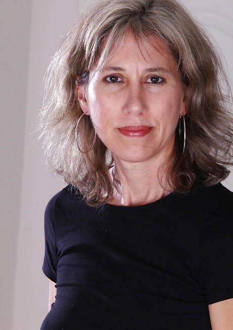 Hot older Olive Jones shows small tits and hairy pussy 